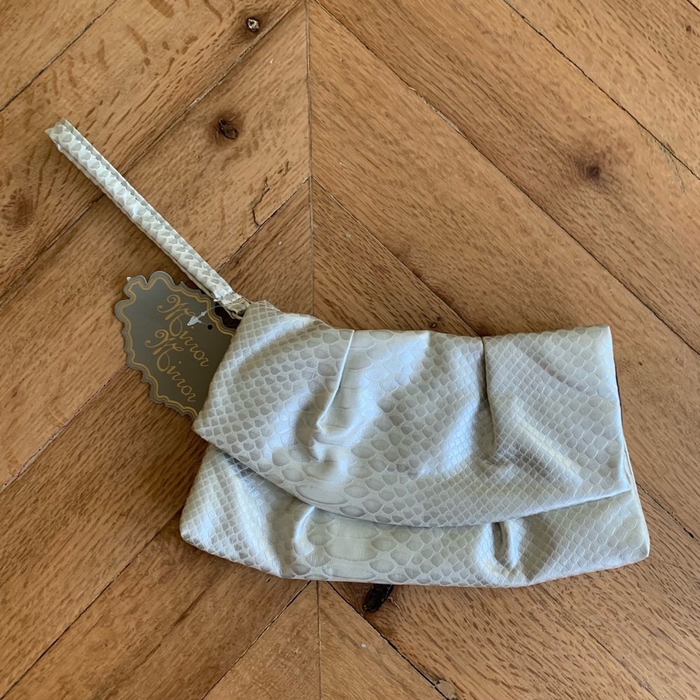 White and silver clutch
